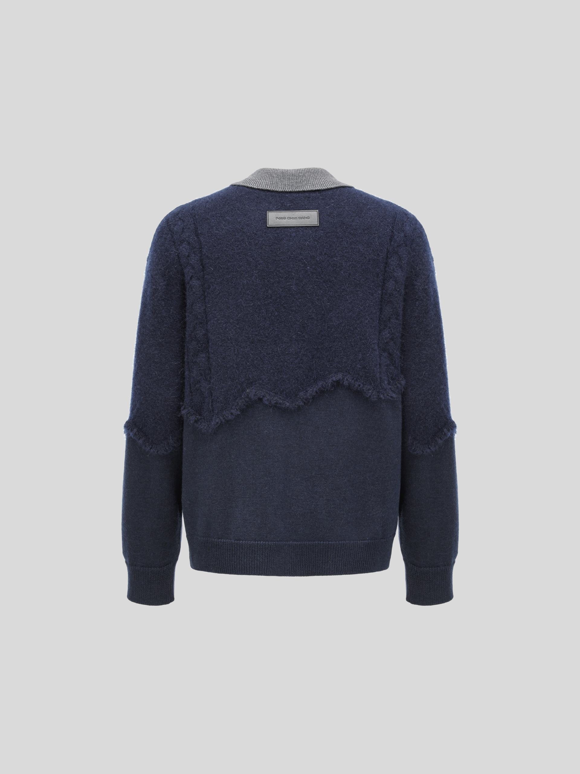CABLE-KNIT POLO SHIRT WITH RAW HEM AND PATCHWORK