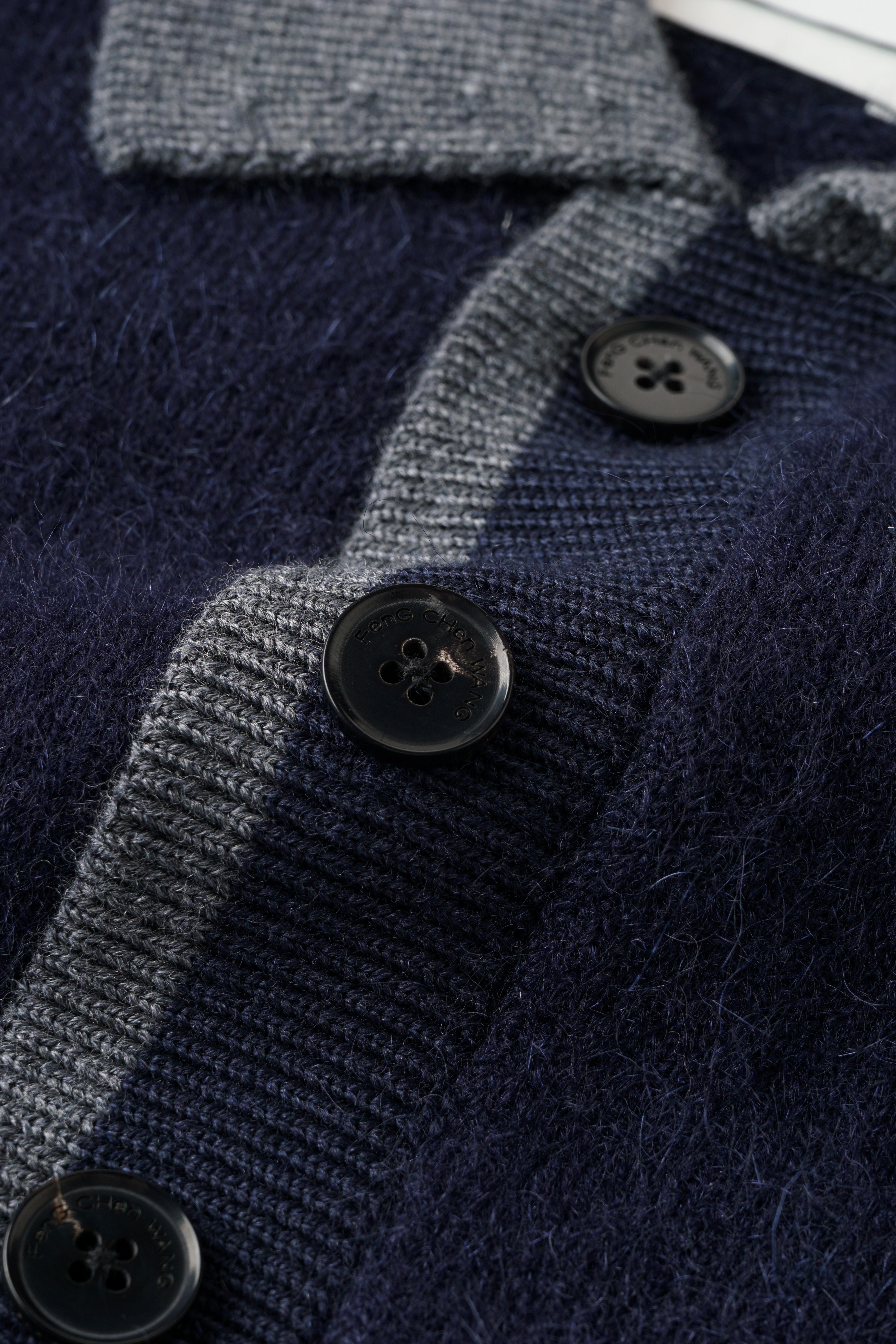 CABLE-KNIT POLO SHIRT WITH RAW HEM AND PATCHWORK