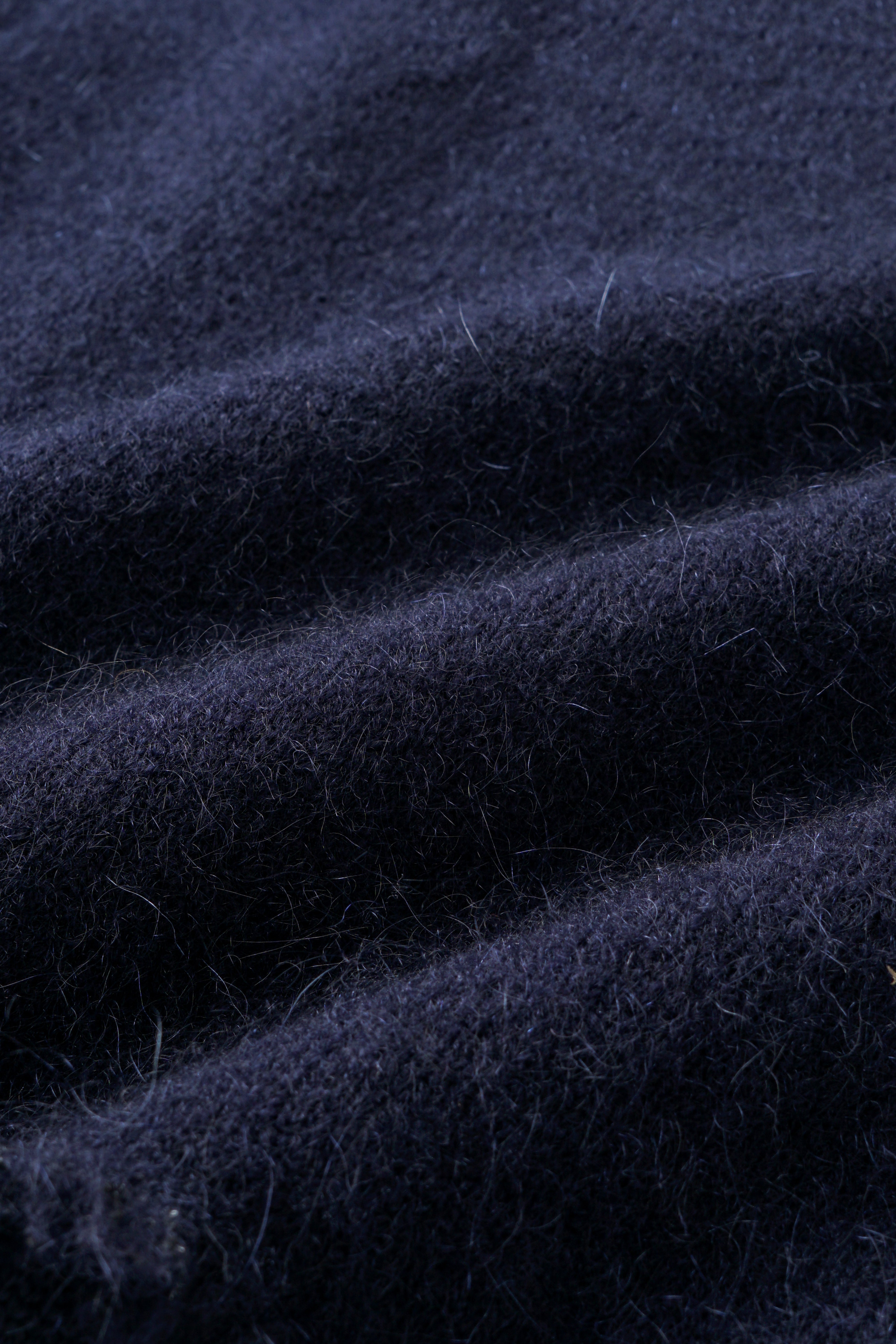 CABLE-KNIT POLO SHIRT WITH RAW HEM AND PATCHWORK