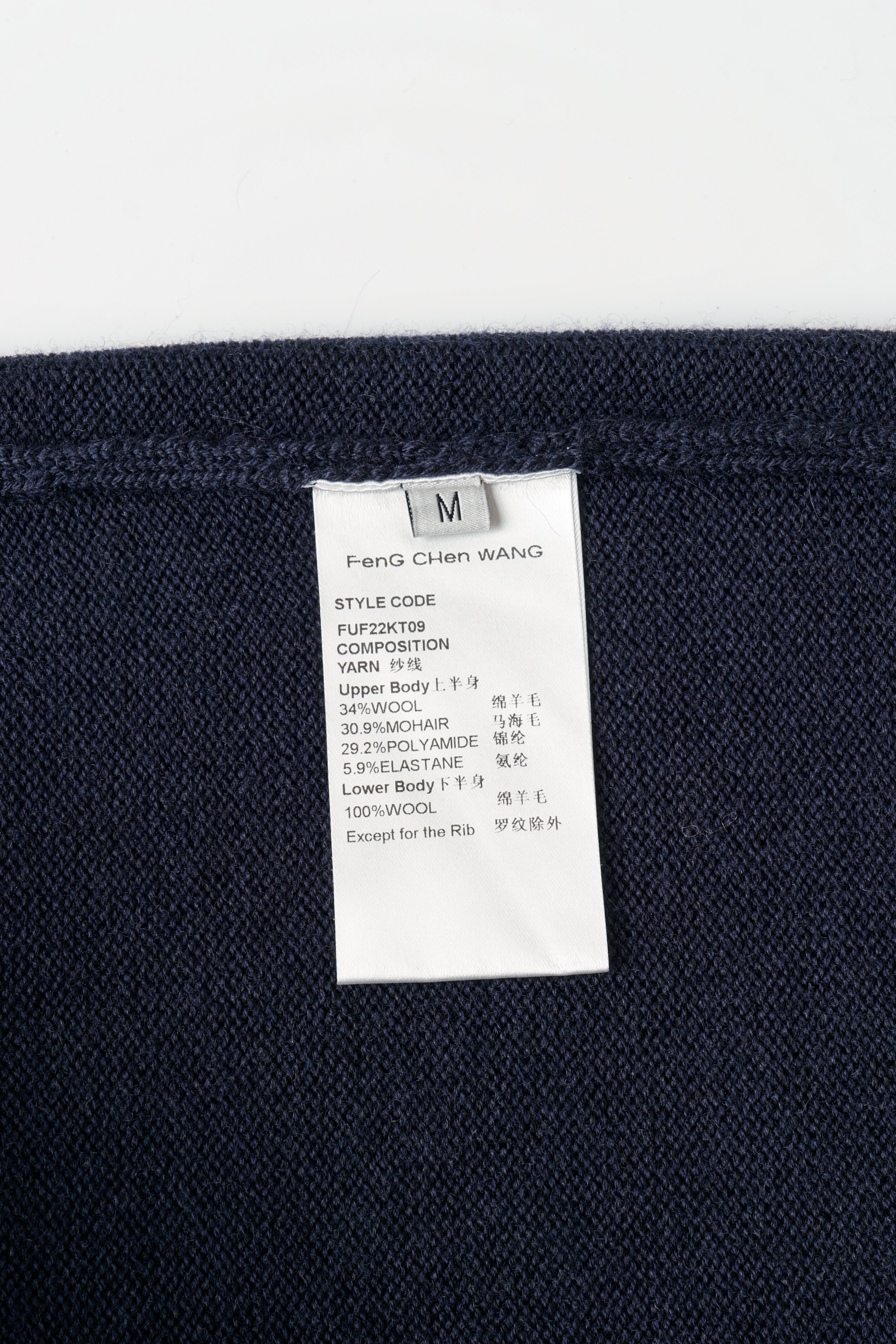 CABLE-KNIT POLO SHIRT WITH RAW HEM AND PATCHWORK