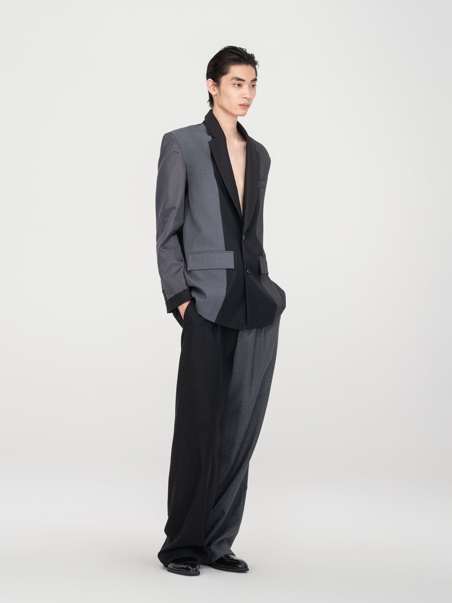 BLACK AND GREY PANELED BLAZER WITH INVERTED STRIPE SLEEVES